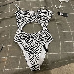 Brand new with tags! Open cut one piece zebra suit